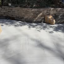 Full deck rebuild with landscape wall