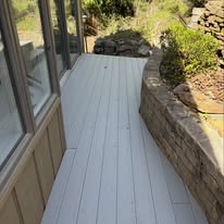 Painted deck & stone retaining wall